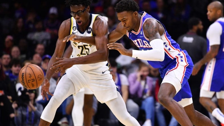 Oct 24, 2022; Philadelphia, Pennsylvania, USA; Indiana Pacers forward Jalen Smith (25) and Philadelphia 76ers forward Paul Reed (44) dive for a loose ball in the second quarter at Wells Fargo Center. Mandatory Credit: Kyle Ross-USA TODAY Sports