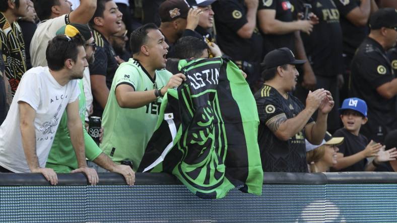 Oct 30, 2022; Los Angeles, California, USA; An Austin FC fan cheers during the conference finals for the Audi 2022 MLS Cup Playoffs against the Los Angeles FC at Banc of California Stadium. Mandatory Credit: Kiyoshi Mio-USA TODAY Sports