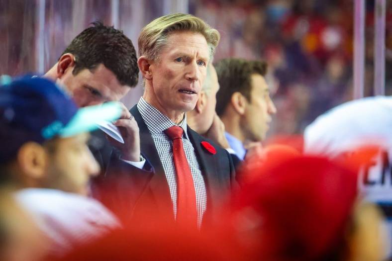 Nov 1, 2022; Calgary, Alberta, CAN; Seattle Kraken head coach Dave Hakstol on his bench against the Calgary Flames during the second period at Scotiabank Saddledome. Mandatory Credit: Sergei Belski-USA TODAY Sports