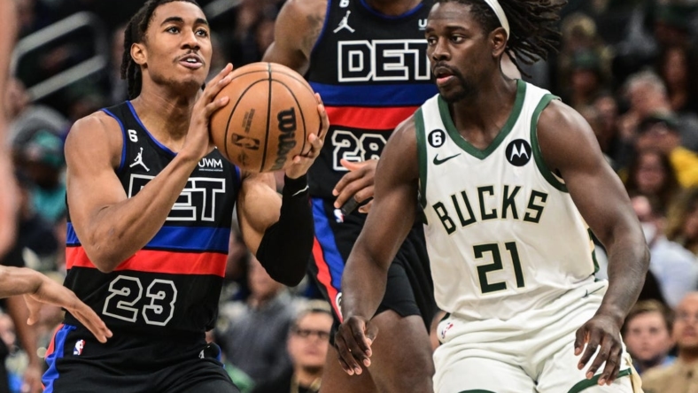 Nov 2, 2022; Milwaukee, Wisconsin, USA; Detroit Pistons guard Jaden Ivey (23) looks for a shot against Milwaukee Bucks guard Jrue Holiday (21) in the fourth quarter at Fiserv Forum. Mandatory Credit: Benny Sieu-USA TODAY Sports
