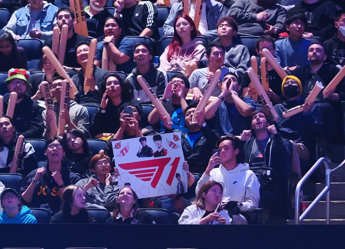 Nov 5, 2022; San Francisco, California, USA;  A fan holds a sign for T1 during the League of Legends World Championships against DRX at Chase Center. Mandatory Credit: Kelley L Cox-USA TODAY Sports