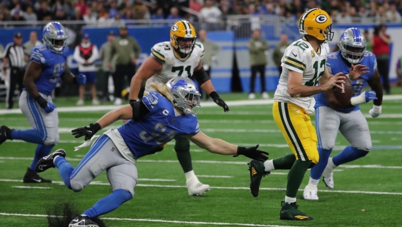 Nov 6, 2022; Detroit, Michigan, USA; Detroit Lions linebacker Alex Anzalone (34) rushes Green Bay Packers quarterback Aaron Rodgers (12) during second half action at Ford Field. Mandatory Credit: Kirthmon F. Dozier-USA TODAY Sports
