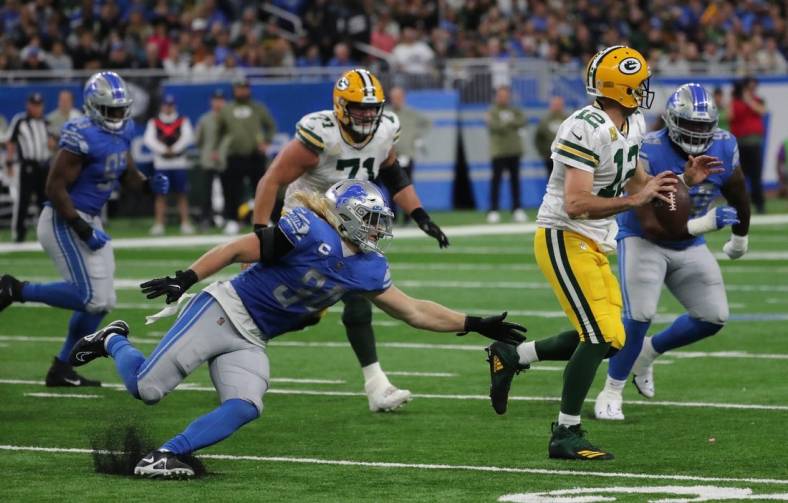 Nov 6, 2022; Detroit, Michigan, USA; Detroit Lions linebacker Alex Anzalone (34) rushes Green Bay Packers quarterback Aaron Rodgers (12) during second half action at Ford Field. Mandatory Credit: Kirthmon F. Dozier-USA TODAY Sports
