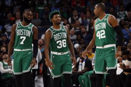 Nov 7, 2022; Memphis, Tennessee, USA; Boston Celtics guard Jaylen Brown (7) guard Marcus Smart (36) and  center Al Horford (42) talk during a timeout during the first half against the Memphis Grizzlies at FedExForum. Mandatory Credit: Petre Thomas-USA TODAY Sports