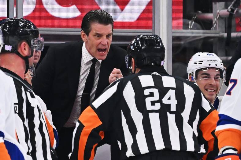 Nov 1, 2022; Chicago, Illinois, USA;  New York Islanders head coach Lane Lambert talks with a referee during a game against the Chicago Blackhawks the United Center. Mandatory Credit: Jamie Sabau-USA TODAY Sports