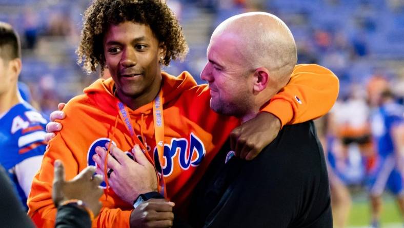 Florida Gators offensive coordinator Rob Sale hugs Florida Gators recruit Jaden Rashada after the game against the South Carolina Gamecocks at Steve Spurrier Field at Ben Hill Griffin Stadium in Gainesville, FL on Saturday, November 12, 2022. [Matt Pendleton/Gainesville Sun]

Ncaa Football Florida Gators Vs South Carolina Gamecocks