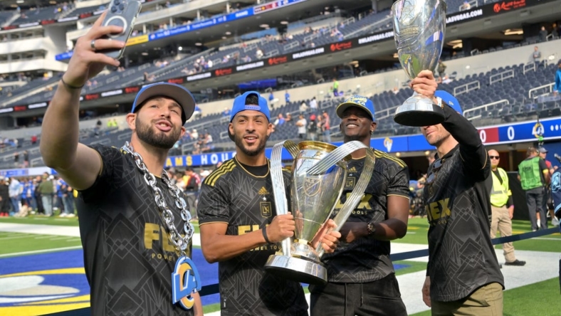 Nov 13, 2022; Inglewood, California, USA;  Los Angeles FC goalkeeper Maxime Crepeau (16), forward Denis Bouanga (99), defender Jesus  Murillo (3) and midfielder Ilie Sanchez (6) hold the MLS Cup on the field prior to the game between the Los Angeles Rams and the Arizona Cardinals at SoFi Stadium. Mandatory Credit: Jayne Kamin-Oncea-USA TODAY Sports