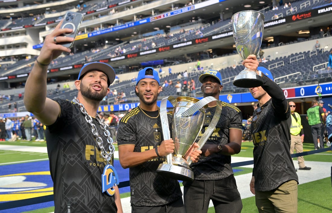 Nov 13, 2022; Inglewood, California, USA;  Los Angeles FC goalkeeper Maxime Crepeau (16), forward Denis Bouanga (99), defender Jesus  Murillo (3) and midfielder Ilie Sanchez (6) hold the MLS Cup on the field prior to the game between the Los Angeles Rams and the Arizona Cardinals at SoFi Stadium. Mandatory Credit: Jayne Kamin-Oncea-USA TODAY Sports