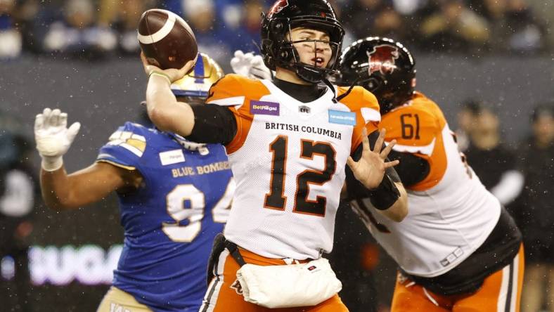 Nov 13, 2022; Winnigeg, Manitoba, CAN; BC Lions quarterback Nathan Rourke (12) throws against the Winnipeg Blue Bombers in the first half at Investors Group Field. Mandatory Credit: James Carey Lauder-USA TODAY Sports