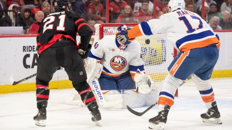 Nov 14, 2022; Ottawa, Ontario, CAN; New York Islanders goalie Semyon Varlamov (40) makes a save on a shot from Ottawa Senators right wing Mathieu Joseph (21) in the first period at the Canadian Tire Centre. Mandatory Credit: Marc DesRosiers-USA TODAY Sports