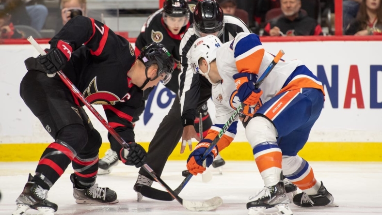 Nov 14, 2022; Ottawa, Ontario, CAN; Ottawa Senators left wing Brady Tkachuk (7) faces off against New York Islanders center Jean-Gabriel Pageau (44) in the second period at the Canadian Tire Centre. Mandatory Credit: Marc DesRosiers-USA TODAY Sports