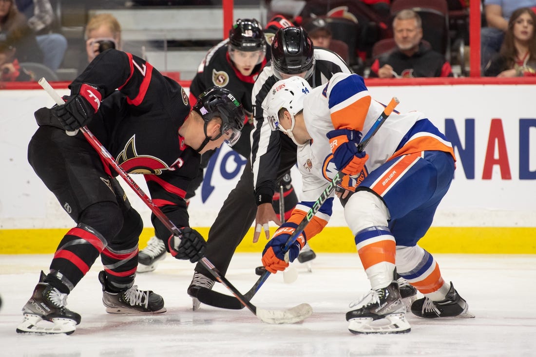 Nov 14, 2022; Ottawa, Ontario, CAN; Ottawa Senators left wing Brady Tkachuk (7) faces off against New York Islanders center Jean-Gabriel Pageau (44) in the second period at the Canadian Tire Centre. Mandatory Credit: Marc DesRosiers-USA TODAY Sports