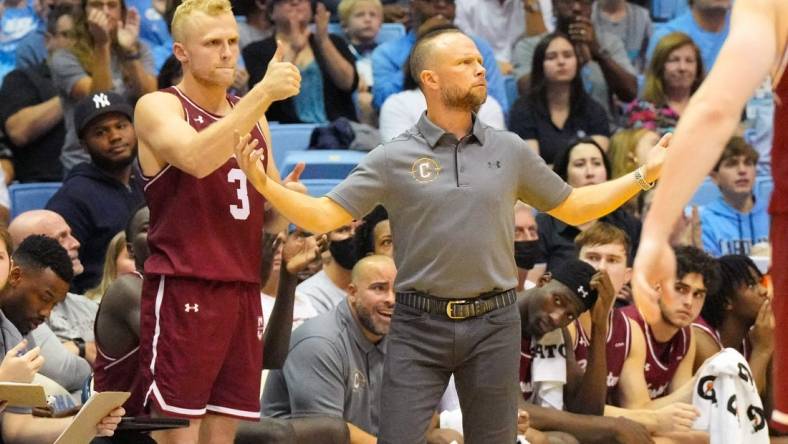 Nov 11, 2022; Chapel Hill, North Carolina, USA;  Charleston Cougars head coach Pat Kelsey and guard Dalton Bolon (3) react against the North Carolina Tar Heels during the second half at Dean E. Smith Center. Mandatory Credit: James Guillory-USA TODAY Sports