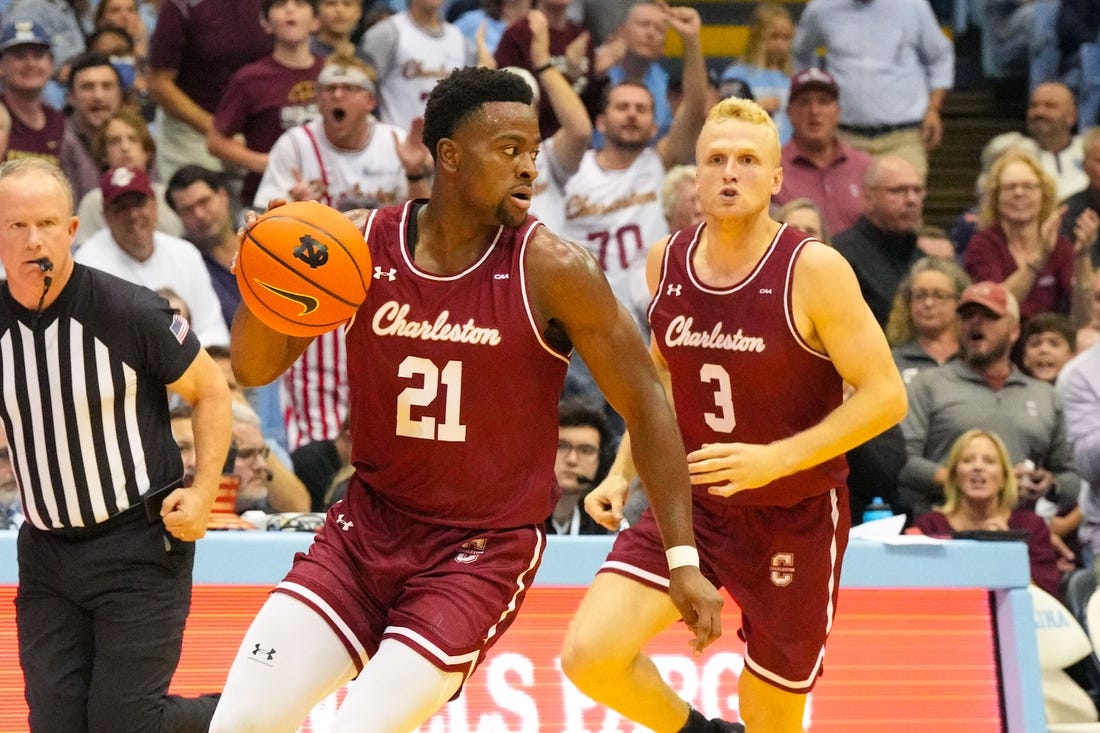 Nov 11, 2022; Chapel Hill, North Carolina, USA;  Charleston Cougars guard Jaylon Scott (21) dribbles the ball next to guard Dalton Bolon (3) during the first half at Dean E. Smith Center. Mandatory Credit: James Guillory-USA TODAY Sports