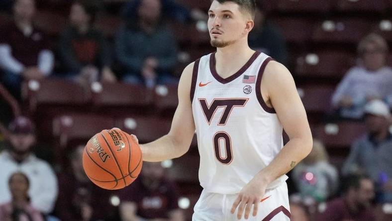 Nov 18, 2022; Charleston, South Carolina, USA; Virginia Tech Hokies guard Hunter Cattoor (0) brings the ball up court in the first half against the Penn State Nittany Lions at TD Arena. Mandatory Credit: David Yeazell-USA TODAY Sports