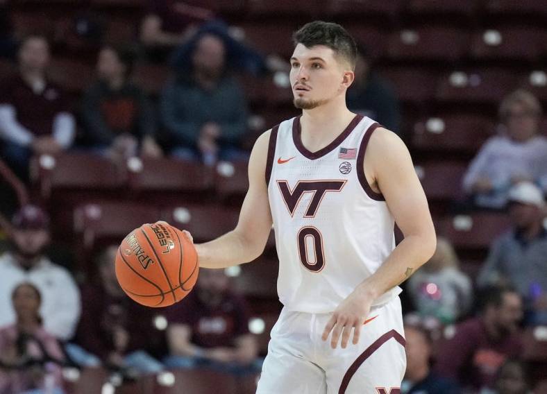 Nov 18, 2022; Charleston, South Carolina, USA; Virginia Tech Hokies guard Hunter Cattoor (0) brings the ball up court in the first half against the Penn State Nittany Lions at TD Arena. Mandatory Credit: David Yeazell-USA TODAY Sports