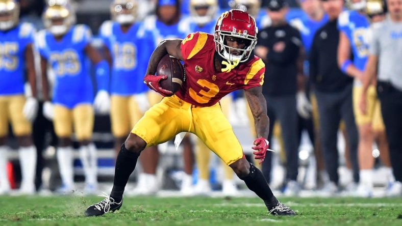 Nov 19, 2022; Pasadena, California, USA; Southern California Trojans wide receiver Jordan Addison (3) runs the ball against the UCLA Bruins during the first half at the Rose Bowl. Mandatory Credit: Gary A. Vasquez-USA TODAY Sports