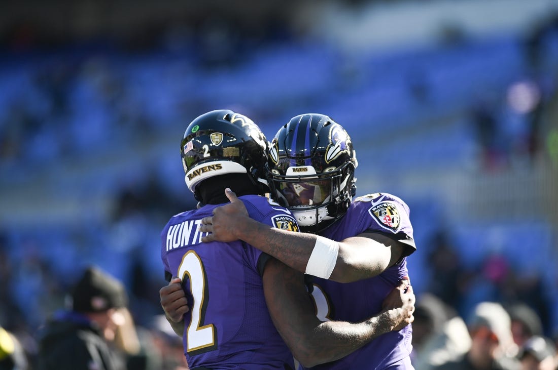 Nov 20, 2022; Baltimore, Maryland, USA;  Baltimore Ravens quarterback Tyler Huntley (2) and quarterback Lamar Jackson (8) hug before the start of the game against the Carolina Panthers at M&T Bank Stadium. Mandatory Credit: Tommy Gilligan-USA TODAY Sports