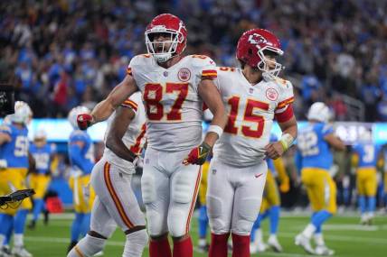 Nov 20, 2022; Inglewood, California, USA; Kansas City Chiefs tight end Travis Kelce (87) celebrates with quarterback Patrick Mahomes (15) after scoring on a 17-yard touchdown reception with 31 seconds left against the Los Angeles Chargers SoFi Stadium. Mandatory Credit: Kirby Lee-USA TODAY Sports