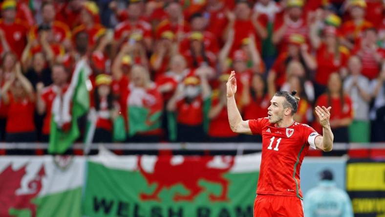 Nov 21, 2022; Al Rayyan, Qatar; Wales forward Gareth Bale (11) celebrates after scoring a goal against the United States of America on a penalty kick during the second half during a group stage match during the 2022 FIFA World Cup at Ahmed Bin Ali Stadium. Mandatory Credit: Yukihito Taguchi-USA TODAY Sports