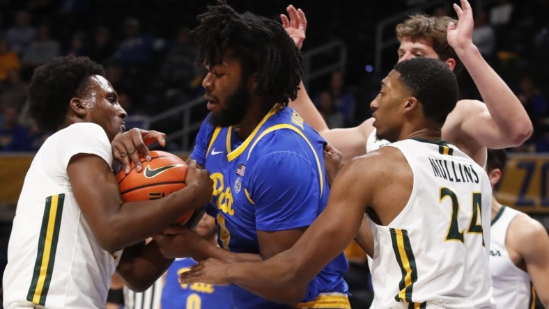 Nov 25, 2022; Pittsburgh, Pennsylvania, USA; William & Mary Tribe guard Gabe Dorsey (left) and Pittsburgh Panthers forward John Hugley IV (4) battle for the ball during the first half at Petersen Events Center. Mandatory Credit: Charles LeClaire-USA TODAY Sports