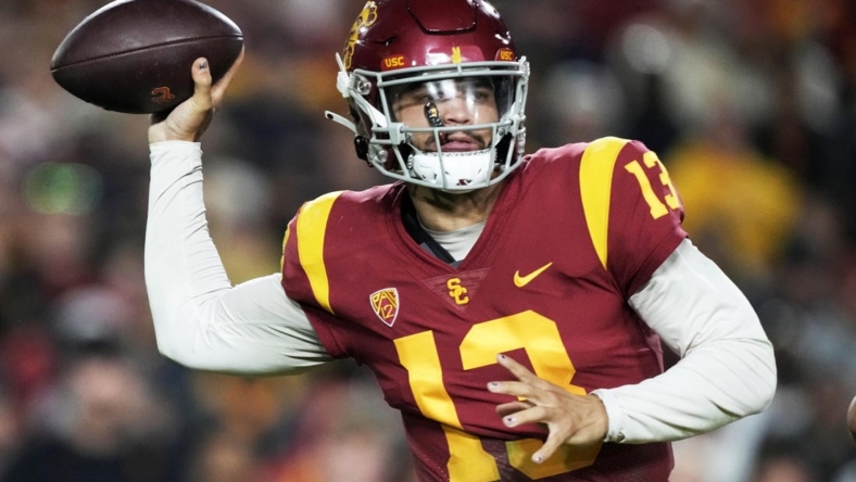 Nov 26, 2022; Los Angeles, California, USA; Southern California Trojans quarterback Caleb Williams (13)  throws the ball against the Notre Dame Fighting Irish in the first half at United Airlines Field at Los Angeles Memorial Coliseum. Mandatory Credit: Kirby Lee-USA TODAY Sports