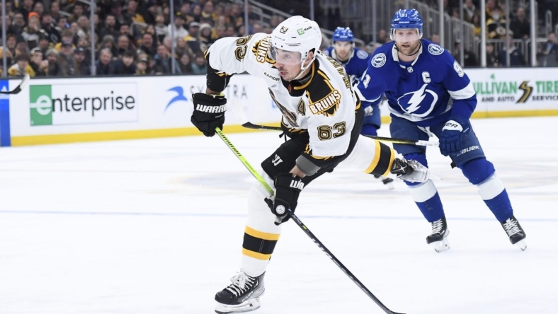 Nov 29, 2022; Boston, Massachusetts, USA;  Boston Bruins left wing Brad Marchand (63) shoots the puck on goal during the third period against the Tampa Bay Lightning at TD Garden. Mandatory Credit: Bob DeChiara-USA TODAY Sports