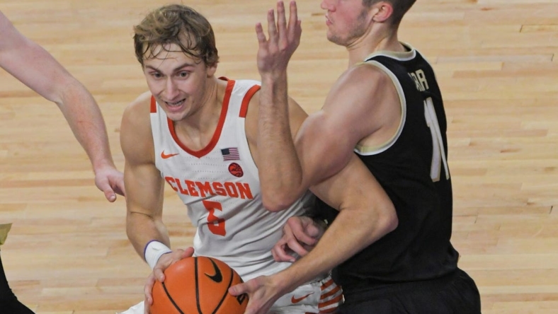 Dec 2, 2022; Clemson, SC, USA;  Clemson forward Hunter Tyson (5) gets ready to shoot near Wake Forest forward Andrew Carr (11) during the second half at Littlejohn Coliseum Friday, December 2, 2022. Mandatory Credit: Ken Ruinard/USA TODAY-USA TODAY NETWORK