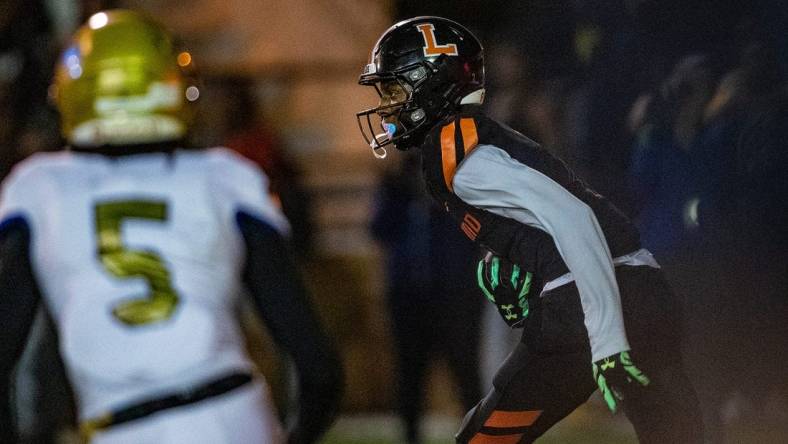 Lakeland (7) Cormani McClain runs back an interception against Osceola during first half action in Lakeland Fl  Friday December 2,2022.Ernst Peters/The Ledger

120222 Ep Preps 9 News