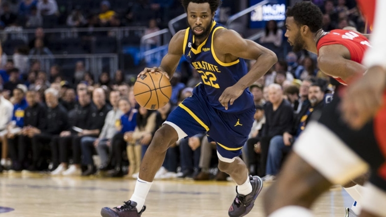 Dec 3, 2022; San Francisco, California, USA;  Golden State Warriors forward Andrew Wiggins (22) dribbles the ball against the Houston Rockets during the second half at Chase Center. Mandatory Credit: John Hefti-USA TODAY Sports