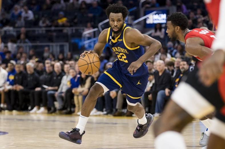 Dec 3, 2022; San Francisco, California, USA;  Golden State Warriors forward Andrew Wiggins (22) dribbles the ball against the Houston Rockets during the second half at Chase Center. Mandatory Credit: John Hefti-USA TODAY Sports