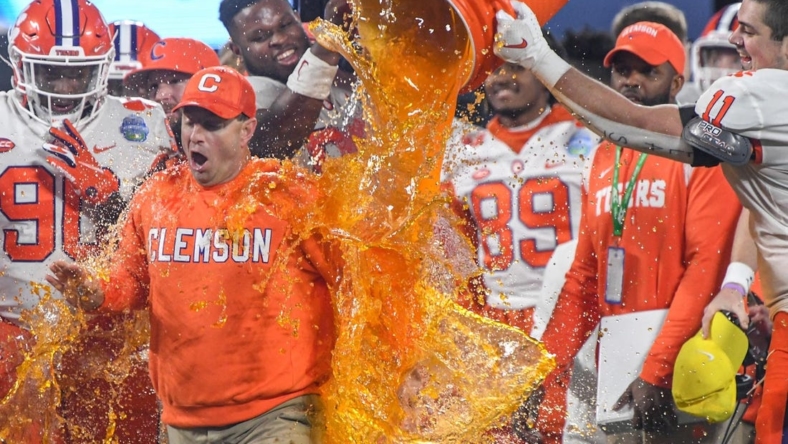 Clemson head coach Dabo Swinney gets dunked with sports drink by Clemson defensive lineman Bryan Bresee (11) during the fourth quarter of the ACC Championship football game at Bank of America Stadium in Charlotte, North Carolina Saturday, Dec 3, 2022.

Clemson Tigers Football Vs North Carolina Tar Heels Acc Championship Charlotte Nc