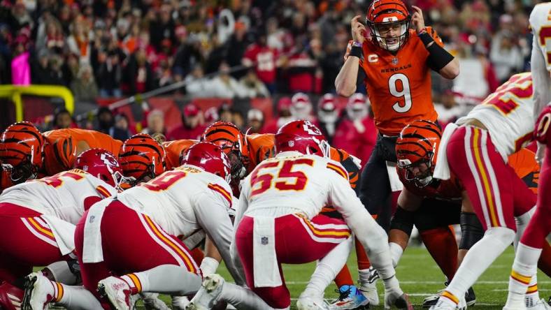 Dec 4, 2022; Cincinnati, Ohio, USA; Cincinnati Bengals quarterback Joe Burrow (9) makes an adjustment as the Bengals go for it on 4th and 1 in the second quarter of a Week 13 NFL game at Paycor Stadium. Mandatory Credit:Sam Greene-USA TODAY Sports