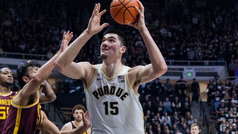 Dec 4, 2022; West Lafayette, Indiana, USA; Purdue Boilermakers center Zach Edey (15) shoots the ball while Minnesota Golden Gophers forward Dawson Garcia (3) defends in the second half at Mackey Arena. Mandatory Credit: Trevor Ruszkowski-USA TODAY Sports