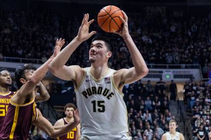 Dec 4, 2022; West Lafayette, Indiana, USA; Purdue Boilermakers center Zach Edey (15) shoots the ball while Minnesota Golden Gophers forward Dawson Garcia (3) defends in the second half at Mackey Arena. Mandatory Credit: Trevor Ruszkowski-USA TODAY Sports