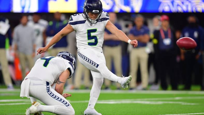 Dec 4, 2022; Inglewood, California, USA; Seattle Seahawks place kicker Jason Myers (5) kicks a field goal against the Los Angeles Rams during the second half at SoFi Stadium. Mandatory Credit: Gary A. Vasquez-USA TODAY Sports