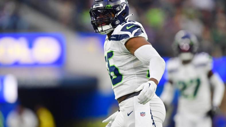 Dec 4, 2022; Inglewood, California, USA; Seattle Seahawks linebacker Jordyn Brooks (56) reacts after sacking Los Angeles Rams quarterback John Wolford (13) during the second half at SoFi Stadium. Mandatory Credit: Gary A. Vasquez-USA TODAY Sports