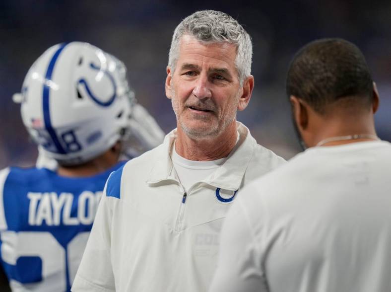 Indianapolis Colts head coach Frank Reich talks on the field Sunday, Oct. 30, 2022, before a game against the Washington Commanders at Indianapolis Colts at Lucas Oil Stadium in Indianapolis.