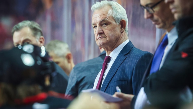 Dec 7, 2022; Calgary, Alberta, CAN; Calgary Flames head coach Darryl Sutter on his bench against the Minnesota Wild during the third period at Scotiabank Saddledome. Mandatory Credit: Sergei Belski-USA TODAY Sports