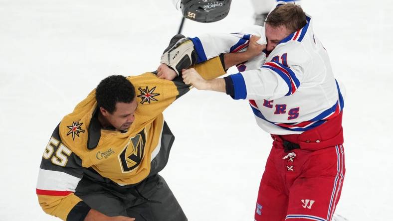 Dec 7, 2022; Las Vegas, Nevada, USA; Vegas Golden Knights right wing Keegan Kolesar (55) fights New York Rangers center Barclay Goodrow (21) during the second period at T-Mobile Arena. Mandatory Credit: Stephen R. Sylvanie-USA TODAY Sports