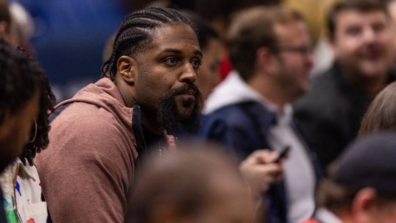 Dec 9, 2022; New Orleans, Louisiana, USA; New Orleans Saints defensive end Cam Jordan looks on at the game between the New Orleans Pelicans and the Phoenix Suns during the first half at Smoothie King Center. Mandatory Credit: Stephen Lew-USA TODAY Sports