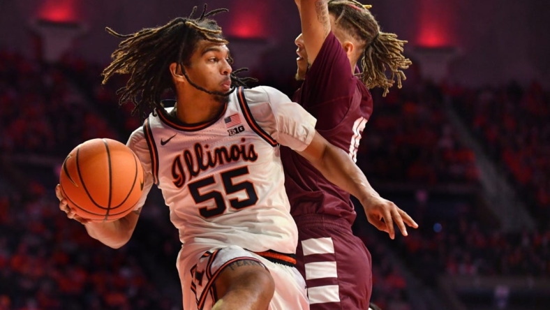 Dec 17, 2022; Champaign, Illinois, USA;  Illinois Fighting Illini guard Skyy Clark (55) drives the ball against Alabama A&M Bulldogs guard Dailin Smith (15) during the first half at State Farm Center. Mandatory Credit: Ron Johnson-USA TODAY Sports