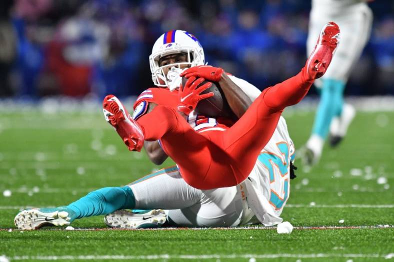 Dec 17, 2022; Orchard Park, New York, USA; Buffalo Bills wide receiver Isaiah McKenzie (6) is tackled by Miami Dolphins cornerback Keion Crossen (27) after a catch in the second quarter at Highmark Stadium. Mandatory Credit: Mark Konezny-USA TODAY Sports