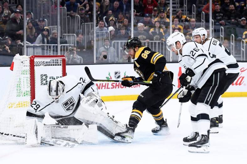 Dec 15, 2022; Boston, Massachusetts, USA;  Los Angeles Kings goaltender Pheonix Copley (29) makes a save while Boston Bruins right wing David Pastrnak (88) looks for a rebound during the first period at TD Garden. Mandatory Credit: Bob DeChiara-USA TODAY Sports