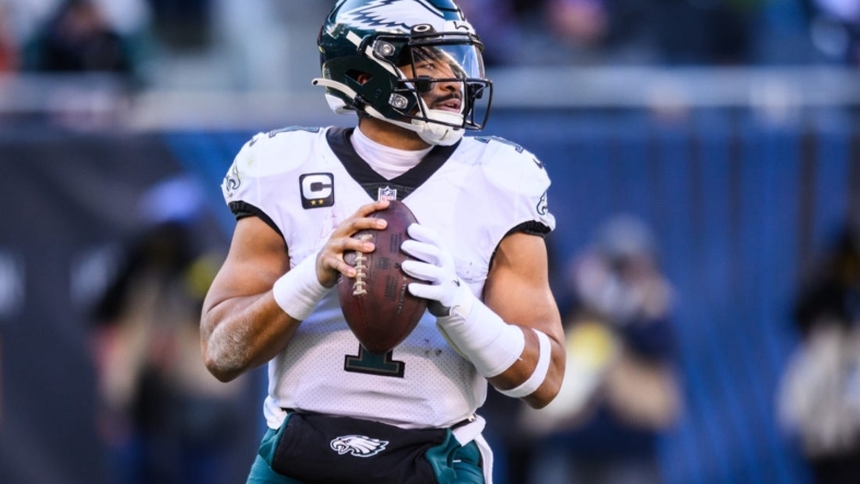 Dec 18, 2022; Chicago, Illinois, USA; Philadelphia Eagles quarterback Jalen Hurts (1) looks to pass in the second quarter against the Chicago Bears at Soldier Field. Mandatory Credit: Daniel Bartel-USA TODAY Sports