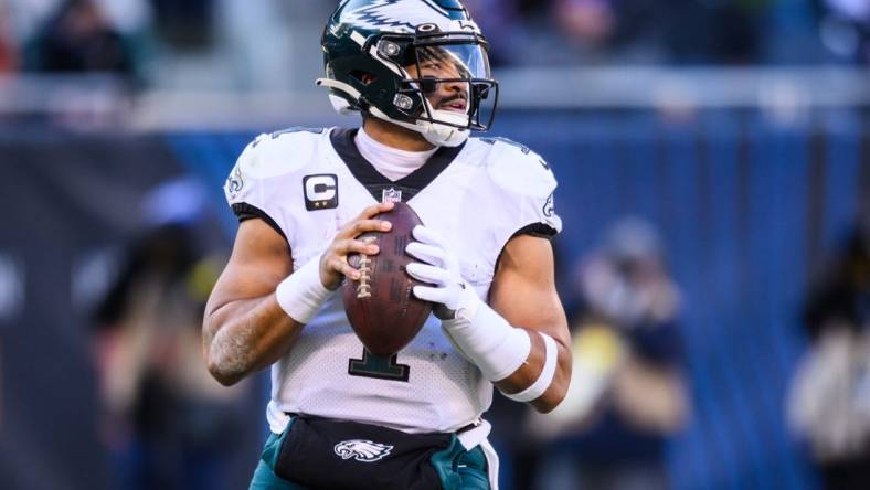 Dec 18, 2022; Chicago, Illinois, USA; Philadelphia Eagles quarterback Jalen Hurts (1) looks to pass in the second quarter against the Chicago Bears at Soldier Field. Mandatory Credit: Daniel Bartel-USA TODAY Sports