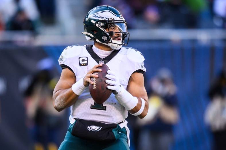 Dec 18, 2022; Chicago, Illinois, USA; Philadelphia Eagles quarterback Jalen Hurts (1) looks to pass in the second quarter against the Chicago Bears at Soldier Field. Mandatory Credit: Daniel Bartel-USA TODAY Sports