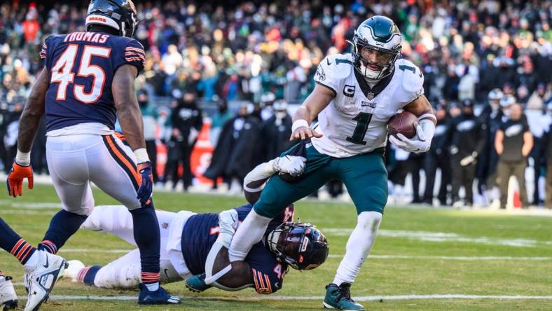 Dec 18, 2022; Chicago, Illinois, USA; Philadelphia Eagles quarterback Jalen Hurts (1) rushes for a two point conversion in the fourth quarter against the Chicago Bears at Soldier Field. Mandatory Credit: Daniel Bartel-USA TODAY Sports