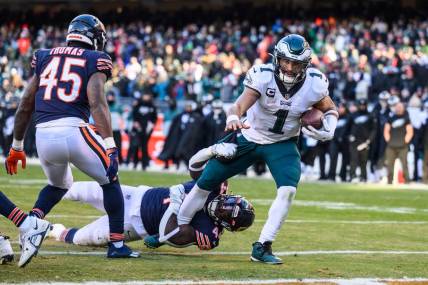Dec 18, 2022; Chicago, Illinois, USA; Philadelphia Eagles quarterback Jalen Hurts (1) rushes for a two point conversion in the fourth quarter against the Chicago Bears at Soldier Field. Mandatory Credit: Daniel Bartel-USA TODAY Sports