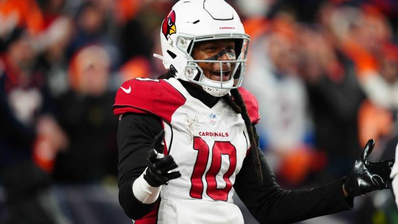 Dec 18, 2022; Denver, Colorado, USA; Arizona Cardinals wide receiver DeAndre Hopkins (10) reacts in the second half against the Denver Broncos at Empower Field at Mile High. Mandatory Credit: Ron Chenoy-USA TODAY Sports